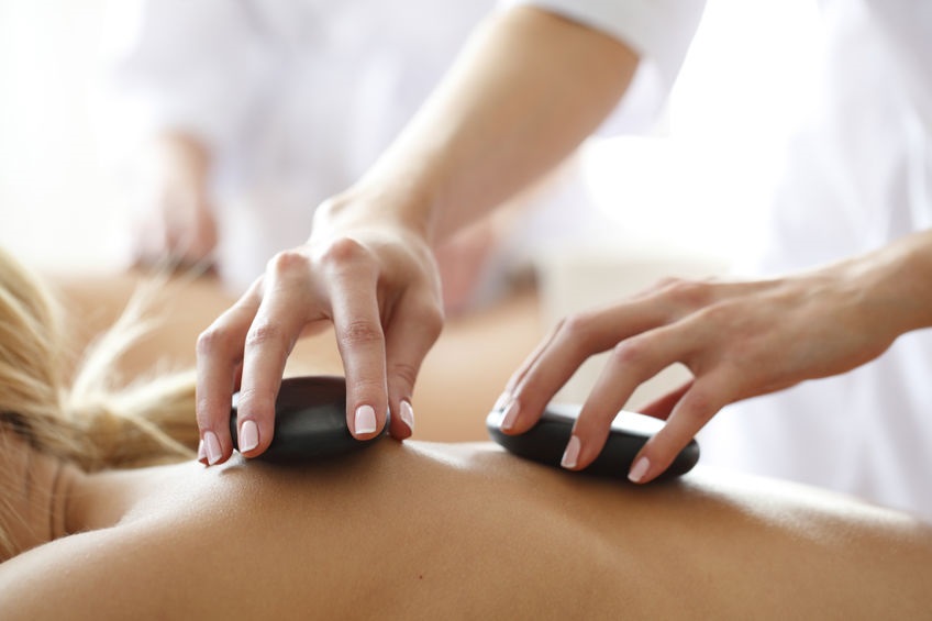 Client receiving a Hot Stone Massage