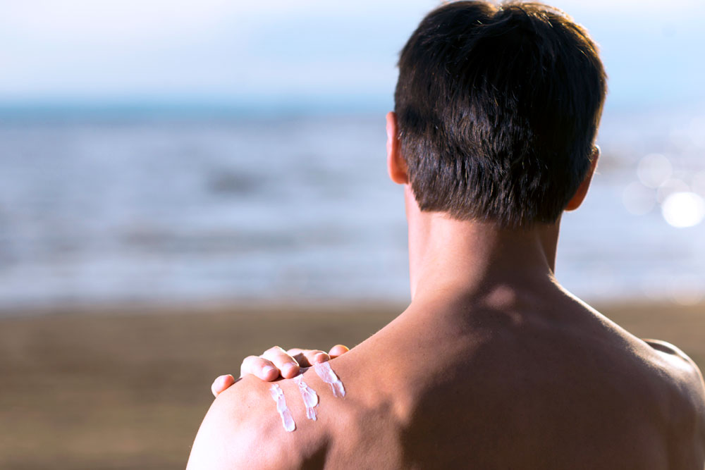 Man applying Sunscreen